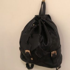 Black Leather backpack with gold buckles